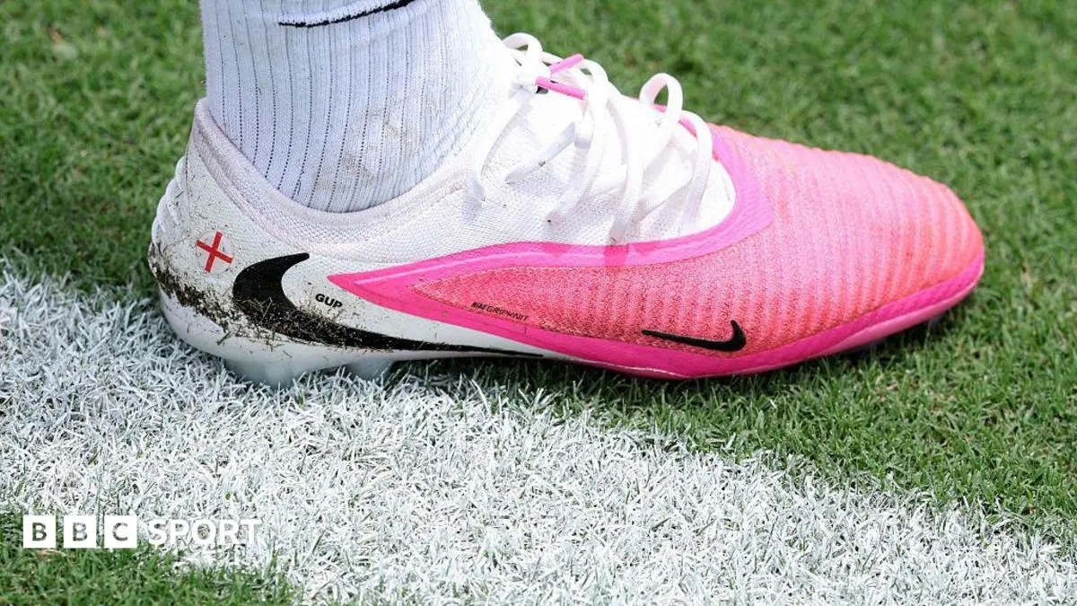 Why are footballers wearing pink boots at the World Cup?